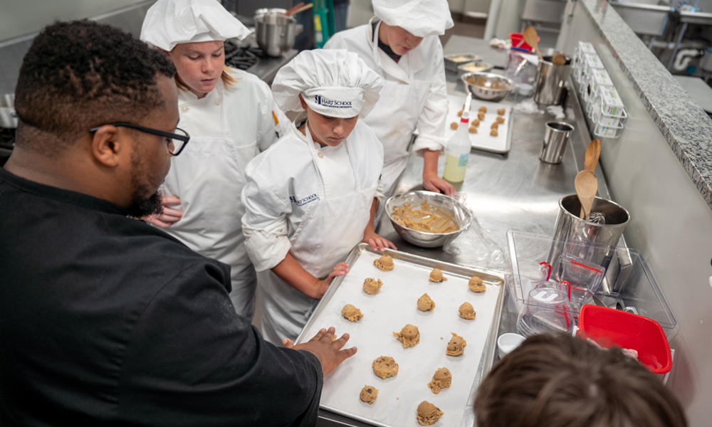 Chef DeAndrae Powell demonstrates how to form his brown butter cookies. 