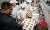 Chef DeAndrae Powell demonstrates how to form his brown butter cookies. 