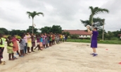 Kuykendall gives basketball demonstration to children in Ghana