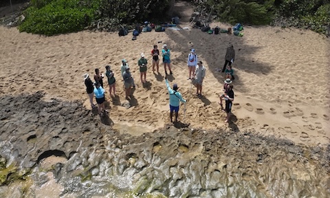 Students working in Puerto Rico near ocean