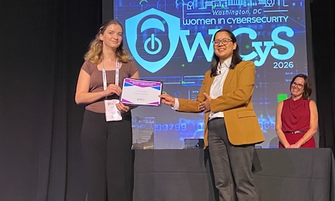 Sarah Hershberger, alongside Dr. Adeen Ayub, receives the Best Undergraduate Research Poster Award for research on industrial control systems security.