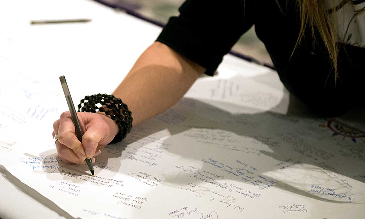 Faculty and staff left messages of greeting and warm wishes for President Alger on a ceremonial scroll. 