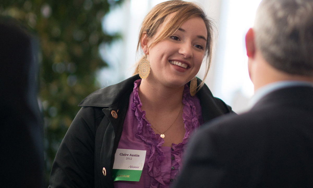 Alumna donor Claire Austin ('12), a political science major, welcomes JMU President Jonathan R. Alger at the Alumni Reception. The event allowed local alumni the opportunity to welcome President Alger to the Madison community. 