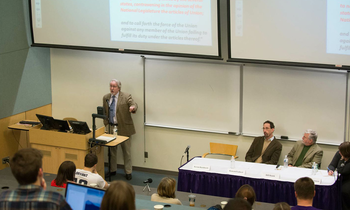 Kevin Hardwick explains the impact of James Madison, a "brilliant politician," in the context of his era. Other participants (L-R) were Howard Lubert (political science), William Hawk (philosophy and religion) and moderator Rebecca Brannon (history).