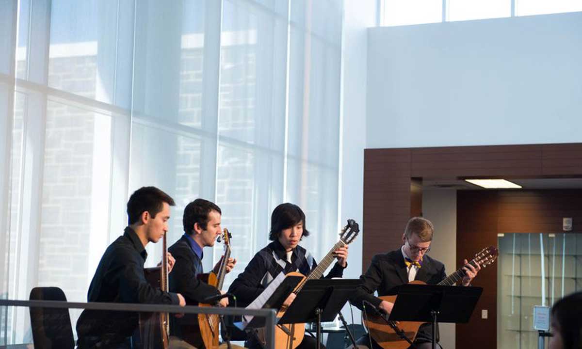 Members of the JMU String Quartet perform for alumni attending the Purple and Gold Reception, in the Forbes Center for the Performing Arts.