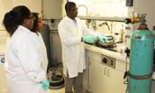 Deaf students and professor in chemistry lab