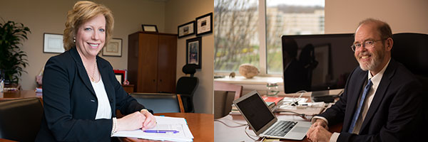 portrait of sharon lovell sitting at her desk on the left and portrait of bob kolvoord sitting at his desk on the right.