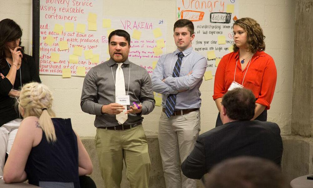 Three JMU students present their idea for virtual reality gaming.