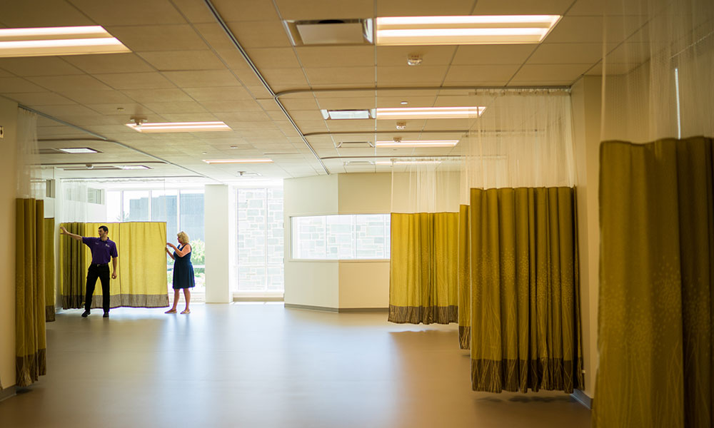 orange chairs in a theater-style classroom