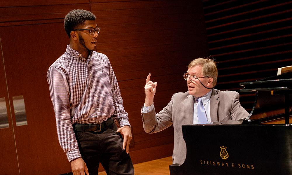 Photo of JMU student Raiquan Thomas with professor Kevin McMillan