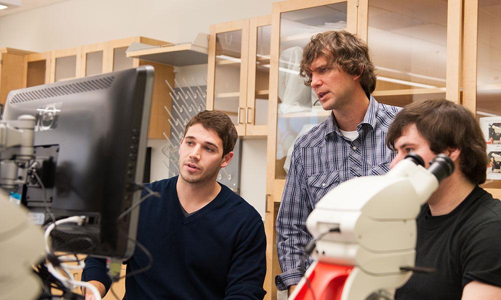 Mark Gabriele ('95) in classroom with students