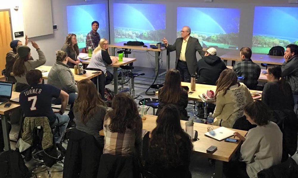 Biology professor Mark Gabriele ('95) in a classroom discussion of the Fueled project.