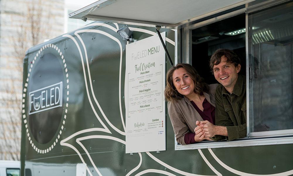 Amanda Presgraves ('16) and professor Mark Gabriele ('95) in the Fueled food truck.