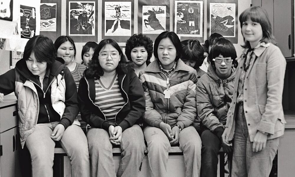 Schwartz with her 1975-76 art students in Selawik, Alaska, and a few of their examples of block printing.