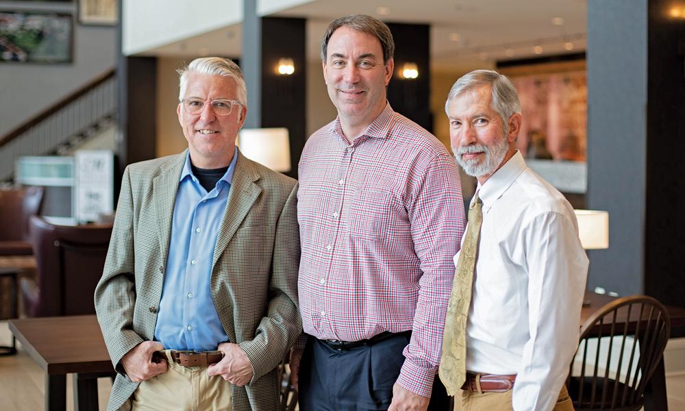 Andy Perrine, Paul Gladd and Eddie Bumbaugh in the Hotel Madison lobby