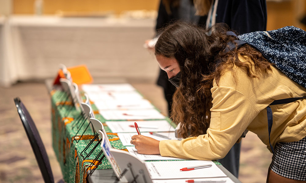 Student signing up for study abroad information