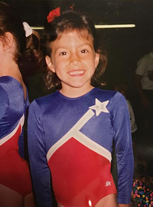 Elly Hart in leotard as a child gymnast