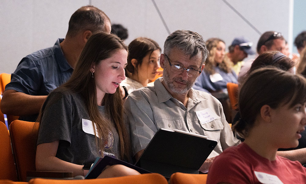 A student talks with her dad during a session.