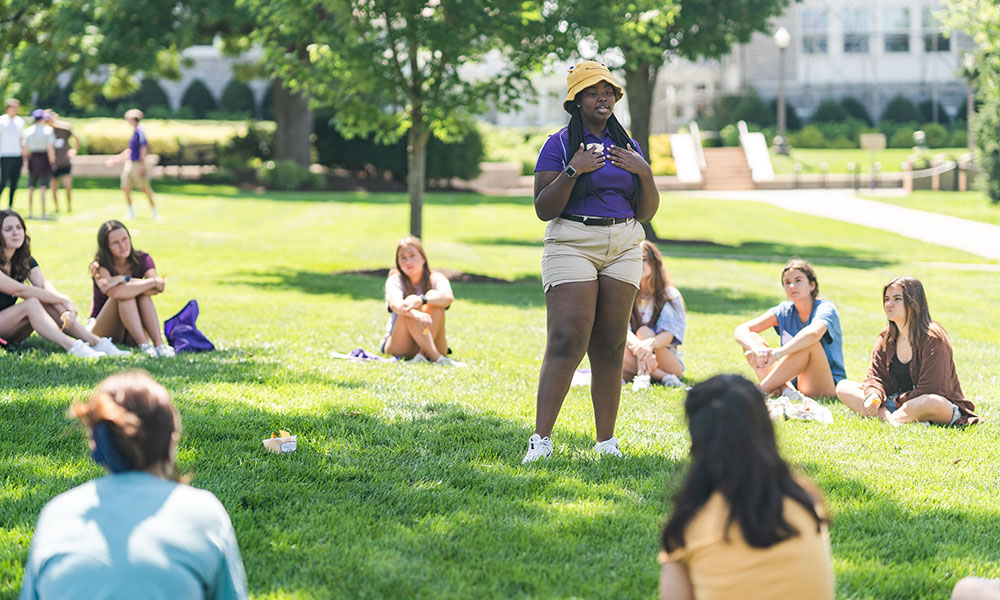 Springboard adviser leads a peer discussion outside