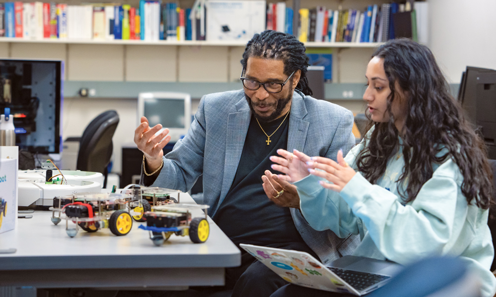 Professor Tony Teate works with fourth-year ISAT student Aarushi Sharma.