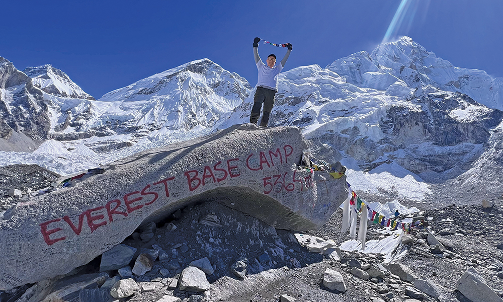 Brian Kurlander celebrates making it to a Mount Everest base camp in fall of 2022.
