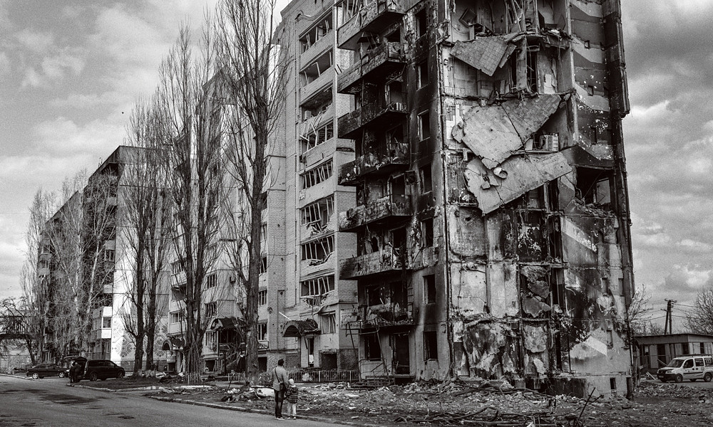 black and white photo of a damaged building in Ukraine caused by Russia's full-scale invasion captured by Sean Sutton/MAG