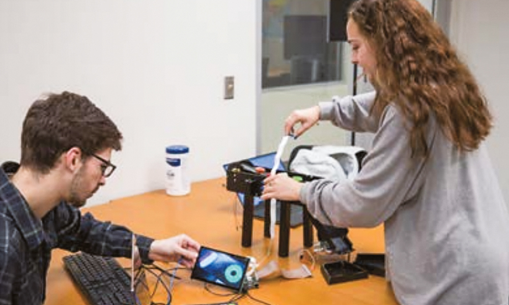 Claire Timmins and capstone project partner, Noah Munis, work on their project in Tony Teate's class.