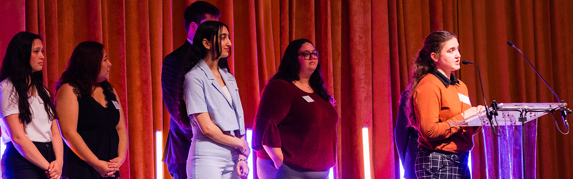 Former Valley Scholars students standing on stage at the Stewardship Luncheon