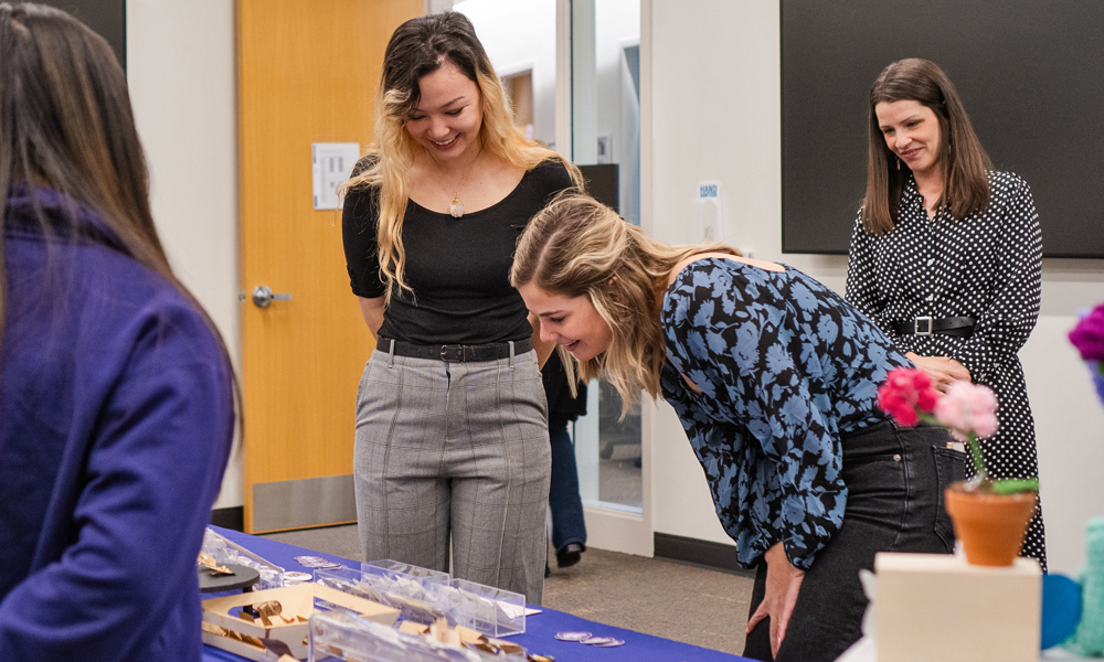 Emily Warden talks with students