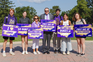 Charlie and Sherry King celebrate the first day of class with students on the Quad.