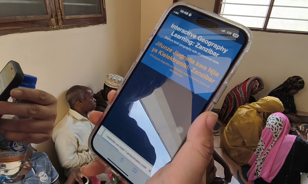 A student holds a smart phone