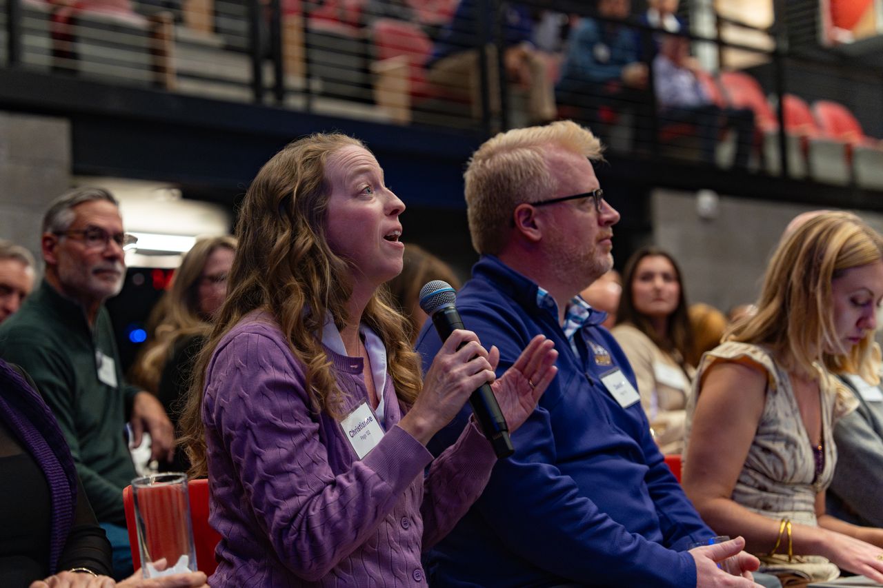 President Jim tour in Norfolk, Virginia, with alumna Christianne Page