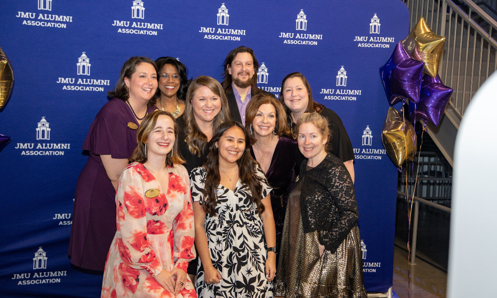 Alumni team posing for a photo