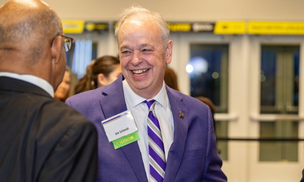 Alumni chatting with President Schmidt