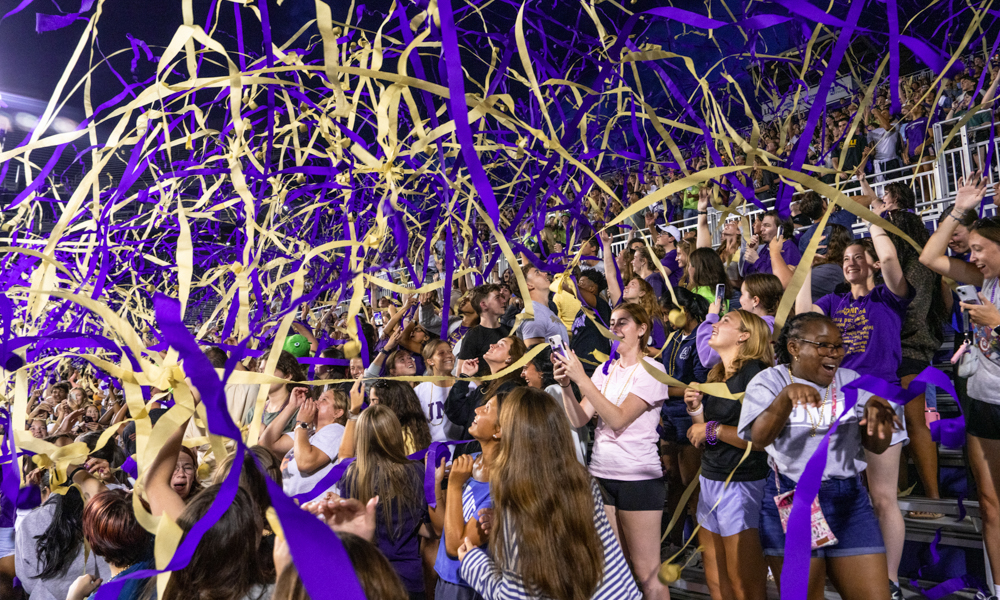 The Class of 2030 throws their first streamers during the Weeks of Welcome Pep Rally in Bridgeforth Stadium.