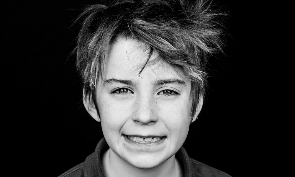A black and white portrait of the late Fletcher Alexander Merkel, a victim of the Annunciation Catholic School Shooting in Minneapolis, Minnesota