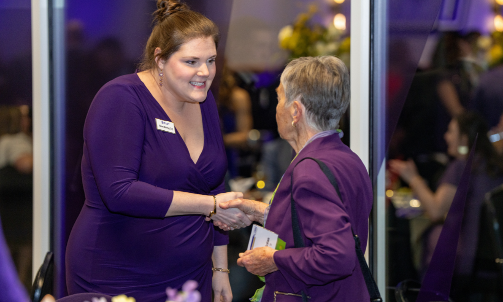 A candid of alumni interacting with each other at the event