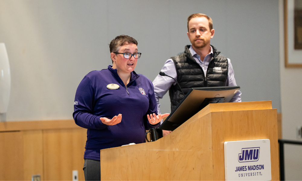 Employee giving committee co-chairs onstage presenting
