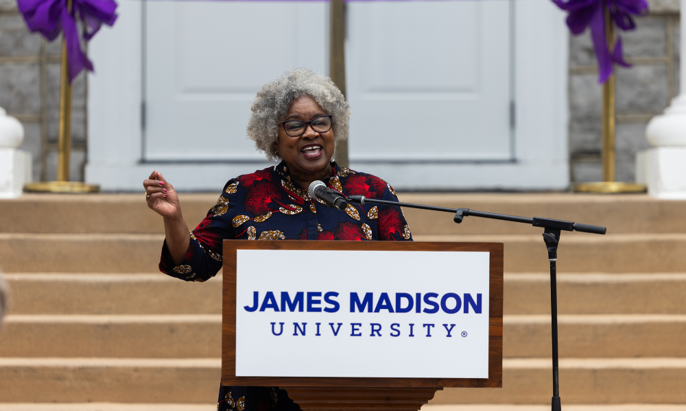 Dr. Joanne Gabbin speaking at a podium