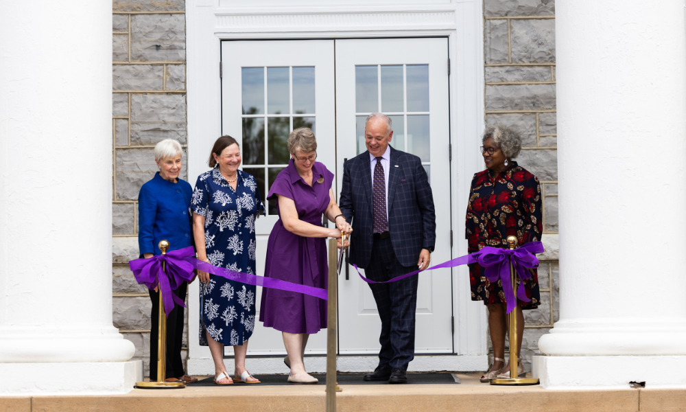 Rosemary Hayes Jones, Joan McCormack Ferrill, Dr. Bethany Nowviskie, Dr. James Schmidt, Dr. Joanne V. Gabbin cut the ribbon to re-open Carrier Library.