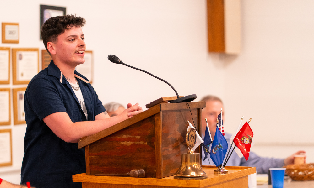 Jeremy Hammer speaking at a podium 