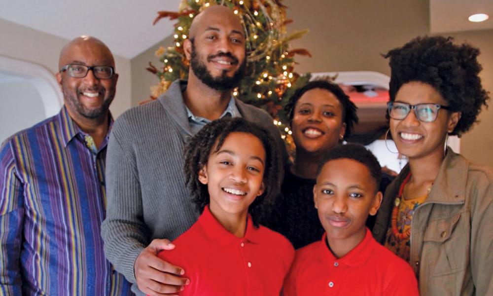 Gilbert Bland with his family of five children.