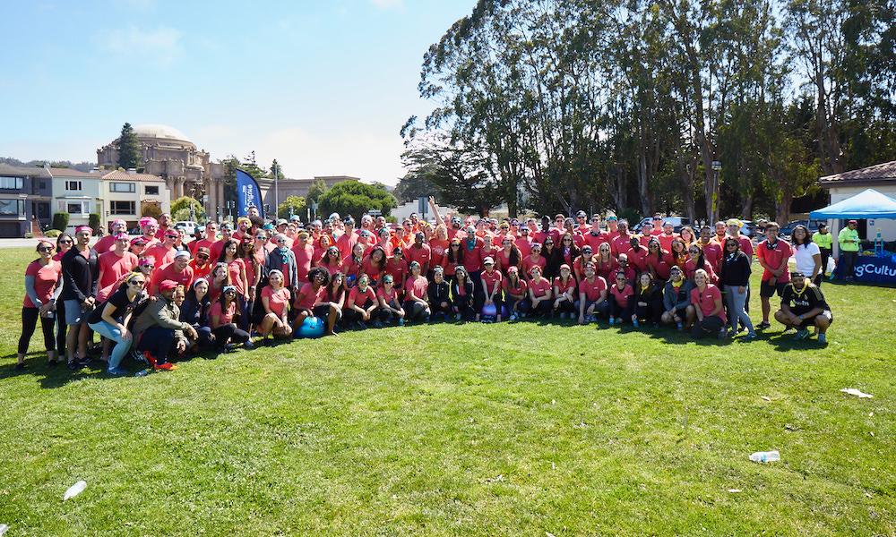 Large group photo of Handshake team members wearing red T-shirts