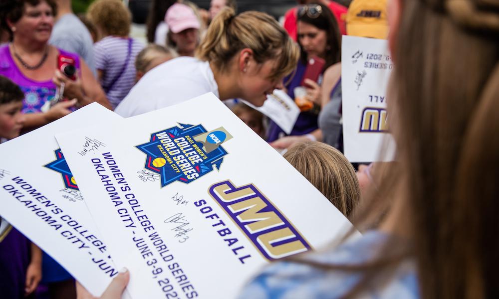 JMU Softball WCWS return home autographs