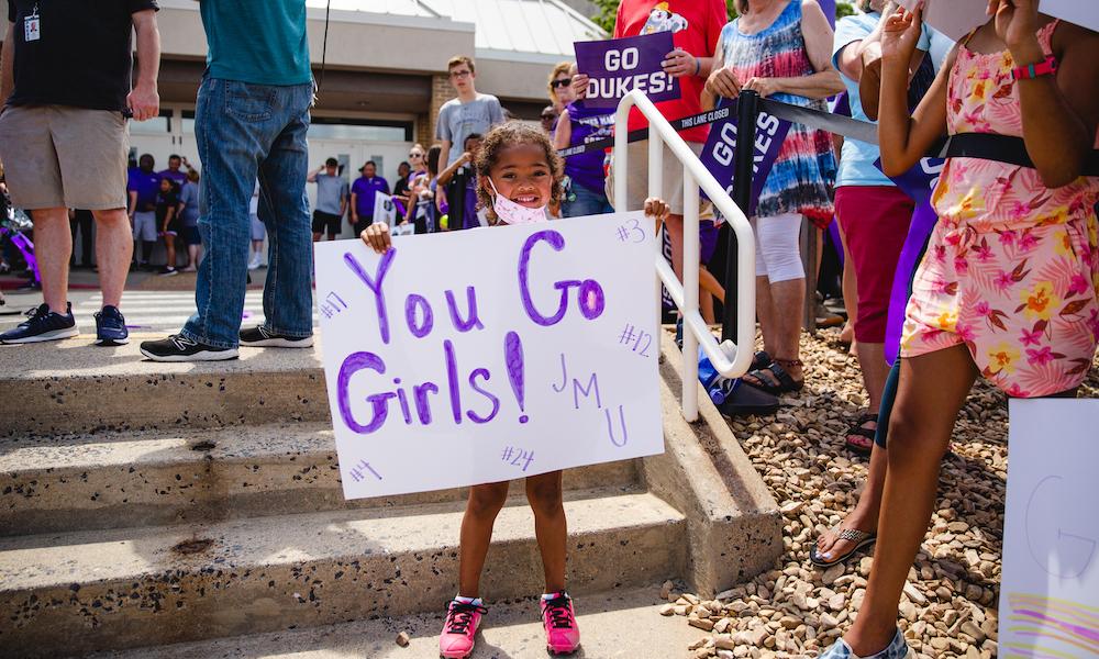 JMU Softball WCWS return home girl