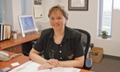 Marilou Johnson seated at desk