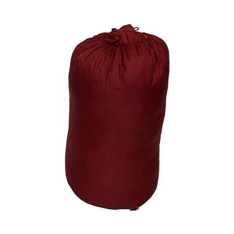 rolled up red sleeping bag in a travel bag