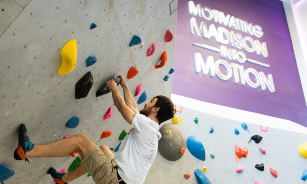 student climbing on bouldering wall