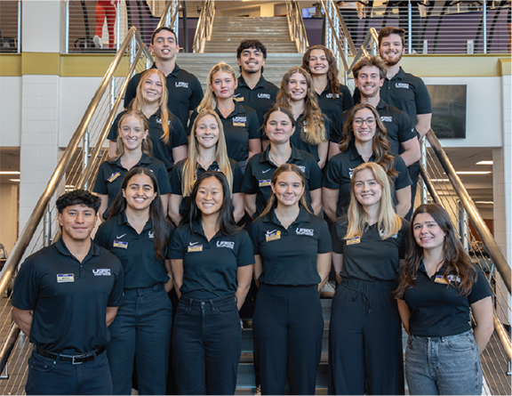 Image of the Operation Supervisors team from 2023 - 2024. The group is posing outside all dressed in their uniforms.