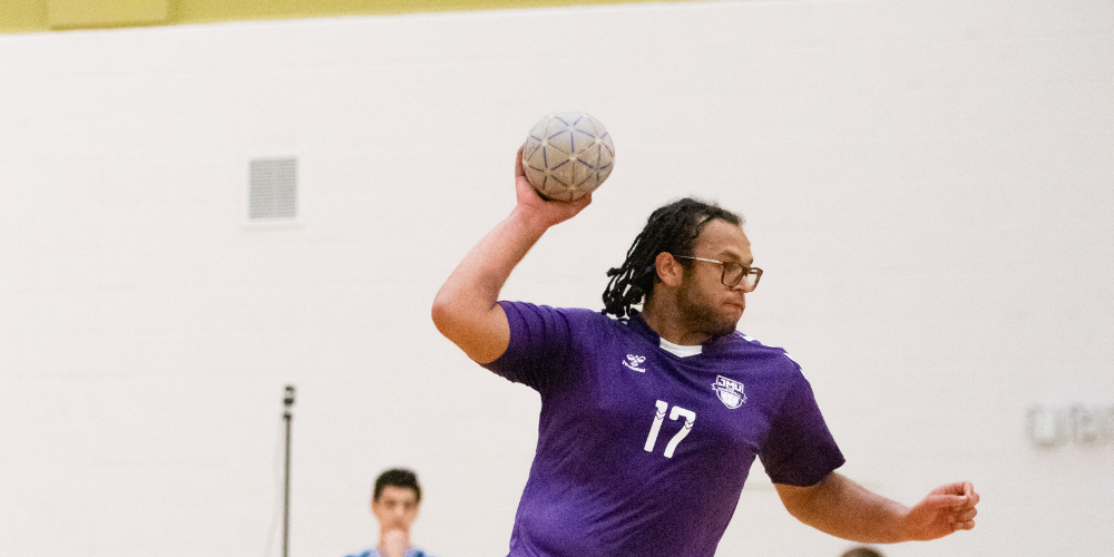 student throwing a handball